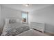 Well-lit bedroom with white furniture, carpet, and window at 909 Shatley Dr, Stockbridge, GA 30281