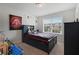 Bright bedroom featuring a large window and playful decor at 909 Shatley Dr, Stockbridge, GA 30281