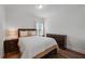 Comfortable bedroom features a Queen-sized bed with coordinated bedding and dark wood furniture at 909 Shatley Dr, Stockbridge, GA 30281