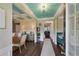 Elegant entryway boasts a coffered ceiling, hardwood floors, and sophisticated decor at 909 Shatley Dr, Stockbridge, GA 30281