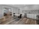 Open concept kitchen with stainless appliances, granite countertops, and mosaic backsplash at 909 Shatley Dr, Stockbridge, GA 30281