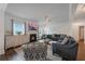 Comfortable living room with fireplace, large windows, and stylish decor at 909 Shatley Dr, Stockbridge, GA 30281