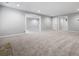 View of a spacious basement with neutral paint, carpet, recessed lighting, and multiple doorways at 1010 Longcreek Pointe, Alpharetta, GA 30005