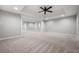 Spacious finished basement area with open floor plan, neutral colors, and ample lighting at 1010 Longcreek Pointe, Alpharetta, GA 30005