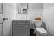 Powder room with vanity, sink, toilet, and white-painted board and batten walls at 1010 Longcreek Pointe, Alpharetta, GA 30005