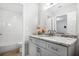 Modern bathroom with white subway tile, wood look floors, and a granite countertop at 1010 Longcreek Pointe, Alpharetta, GA 30005