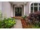 Inviting front entrance with double doors, stone steps, and vibrant landscaping at 1010 Longcreek Pointe, Alpharetta, GA 30005