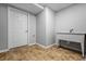 Small laundry room with neutral paint, tile floors, and utilitarian sink at 1010 Longcreek Pointe, Alpharetta, GA 30005