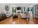 Comfortable living room with hardwood floors, a fireplace, built-in shelves and access to backyard at 1010 Longcreek Pointe, Alpharetta, GA 30005