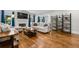 Cozy living room features a fireplace, hardwood floors, natural light, and built-in shelving at 1010 Longcreek Pointe, Alpharetta, GA 30005