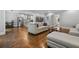 Open living space with stainless steel kitchen, stairs, hardwood floors and cozy seating at 1010 Longcreek Pointe, Alpharetta, GA 30005