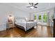 Relaxing main bedroom features hardwood floors, tray ceilings, natural light, and balcony access at 1010 Longcreek Pointe, Alpharetta, GA 30005