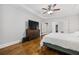 Tranquil main bedroom features hardwood floors, tray ceiling, a dresser, and a closet at 1010 Longcreek Pointe, Alpharetta, GA 30005