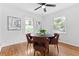 Bright dining area with hardwood floors and modern decor, illuminated by natural light from two windows at 1192 Willivee Dr, Decatur, GA 30033