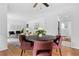 Open-concept dining area with view of living room and kitchen featuring a round table and four chairs at 1192 Willivee Dr, Decatur, GA 30033
