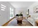Elegant living room featuring neutral decor, hardwood floors, and sun-filled windows at 1192 Willivee Dr, Decatur, GA 30033