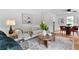 Bright living room featuring modern decor, hardwood floors, and stylish furniture at 1192 Willivee Dr, Decatur, GA 30033