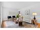 Cozy living room with hardwood floors, comfortable seating, and ample natural light at 1192 Willivee Dr, Decatur, GA 30033