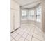 Sunlit breakfast nook in the kitchen with large windows and tile flooring at 654 Continental Dr, Lawrenceville, GA 30044