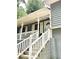 Close up of the front steps and door, showing the house number and charming architectural details at 654 Continental Dr, Lawrenceville, GA 30044