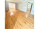 Bright and spacious living room with polished hardwood floors, and an open layout at 654 Continental Dr, Lawrenceville, GA 30044