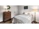 Bedroom with neutral colors, hardwood floors, and bright natural light at 7114 Surrey Pt, Alpharetta, GA 30009