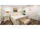 Bright bedroom features hardwood floors, an outdoor sitting area, and shiplap accent wall at 7114 Surrey Pt, Alpharetta, GA 30009