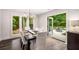 Dining room with backyard views and access to the outdoor patio at 7114 Surrey Pt, Alpharetta, GA 30009