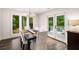 Dining room with view to the backyard and outdoor patio at 7114 Surrey Pt, Alpharetta, GA 30009