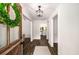 Bright entryway with wood floors leading to an open kitchen and living space at 7114 Surrey Pt, Alpharetta, GA 30009