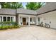 Inviting porch area with a swing, a bicycle, and manicured garden at 7114 Surrey Pt, Alpharetta, GA 30009