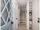 Entryway features hardwood floors, open staircase, and lots of storage at 7114 Surrey Pt, Alpharetta, GA 30009
