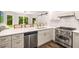 Bright kitchen with stainless steel appliances and quartz countertops at 7114 Surrey Pt, Alpharetta, GA 30009