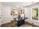 Spacious office with built in shelving, and hardwood floors at 7114 Surrey Pt, Alpharetta, GA 30009