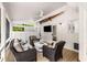 Cozy screened patio with comfortable seating, TV, and a washer/dryer combo at 7114 Surrey Pt, Alpharetta, GA 30009