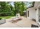 Entertain on the patio with a picnic table and backyard views of the landscaped backyard at 7114 Surrey Pt, Alpharetta, GA 30009