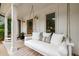 Relaxing porch swing, perfect for enjoying the outdoors with an inviting front door at 7114 Surrey Pt, Alpharetta, GA 30009