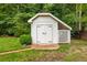 Charming shed with brick path and lush backyard landscaping at 7114 Surrey Pt, Alpharetta, GA 30009