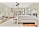Cozy bedroom with a decorative bed frame, hardwood floors, and access to an outdoor terrace at 210 4Th St, Fayetteville, GA 30214