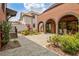 Brick courtyard features a manicured landscape, brick walkways, and access to multiple outdoor living spaces at 210 4Th St, Fayetteville, GA 30214