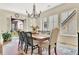 Bright dining room with large windows, chandelier, and access to an outdoor patio at 210 4Th St, Fayetteville, GA 30214