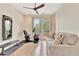 Spacious exercise room with hardwood floors, ample natural light, and modern fitness equipment at 210 4Th St, Fayetteville, GA 30214