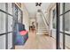 Inviting foyer with hardwood floors, coat rack, and staircase leading to the upper level at 210 4Th St, Fayetteville, GA 30214