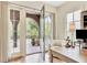 Bright home office featuring hardwood floors, French doors to a balcony, and a comfortable workspace at 210 4Th St, Fayetteville, GA 30214