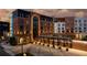 Elegant hotel exterior showcasing a mix of brick and modern design with ample lighting and landscaping at 210 4Th St, Fayetteville, GA 30214