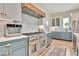 Well-equipped kitchen featuring custom cabinetry, professional-grade appliances, and tile backsplash at 210 4Th St, Fayetteville, GA 30214