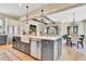 Spacious kitchen with a large island, stainless steel appliances, and open layout to the dining area at 210 4Th St, Fayetteville, GA 30214