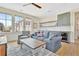 Inviting living room features a wet bar, hardwood floors, and an abundance of natural light through large windows at 210 4Th St, Fayetteville, GA 30214