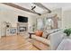 Cozy living room with a stone fireplace, comfortable seating, and plenty of natural light at 210 4Th St, Fayetteville, GA 30214
