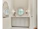 Stylish powder room featuring a round window, custom vanity, and patterned tile flooring at 210 4Th St, Fayetteville, GA 30214